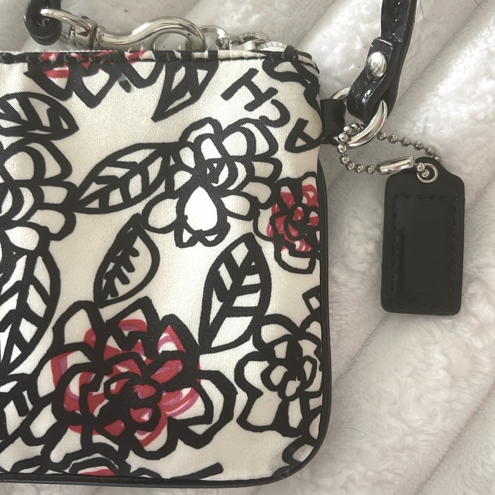Coach Poppy Floral Wristlet with Black and Red Accents EUC
No Callouts - Picture 6 of 10